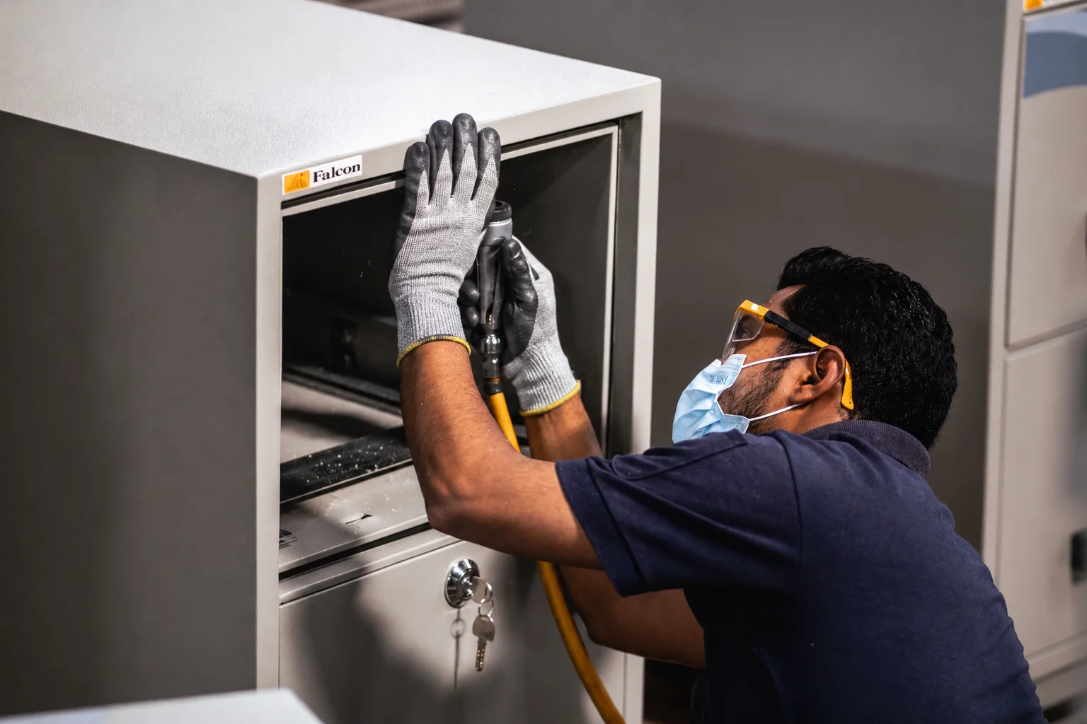 Falcon Safe technician servicing a safe